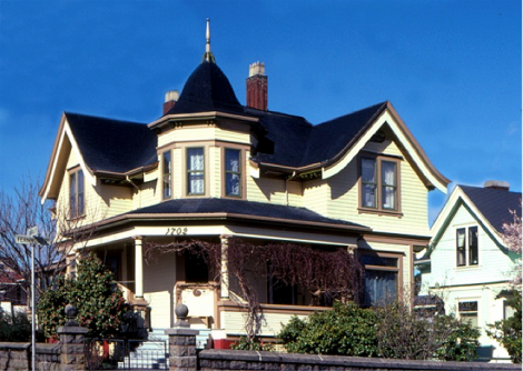 The popularity of Queen Anne architecture for homes continued on into the 20th century. Though lacking the exuberant woodwork that was common at the height of the style, this stripped-down Edwardian version c1908 in Victoria, B.C., is still recognizable as a Queen Anne home.  The corner tower, fanciful eaves, the prominent corner front porch and the stained glass transoms over the large downstairs windows all point to its earlier design precedents.