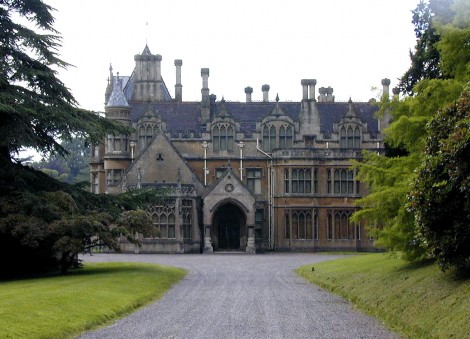 A grand English House in the Gothic Revival style: Tyntesfield House, designed by architect John Norton in 1863. Near Wraxall, North Somerset, England. Gothic style windows, trefoil decoration and a spiky, picturesque roofline are features of the style in grand homes Now owned by the National Trust, and open to the public.